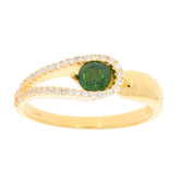 Round green Moissanite ring in sterling silver, accented with sparkling stones, showcasing elegance and luxury.
